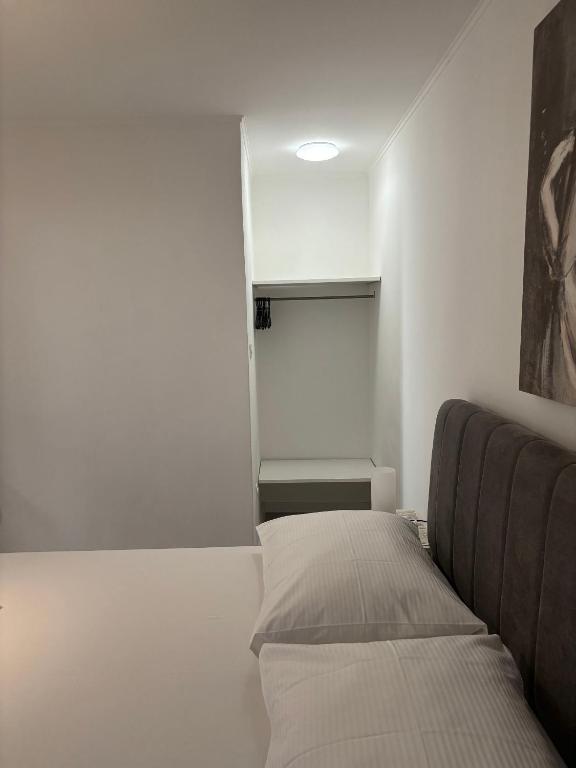 Posteľ alebo postele v izbe v ubytovaní Apartments Sini