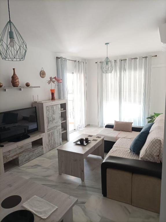 TV a/nebo společenská místnost v ubytování Ferrara playa