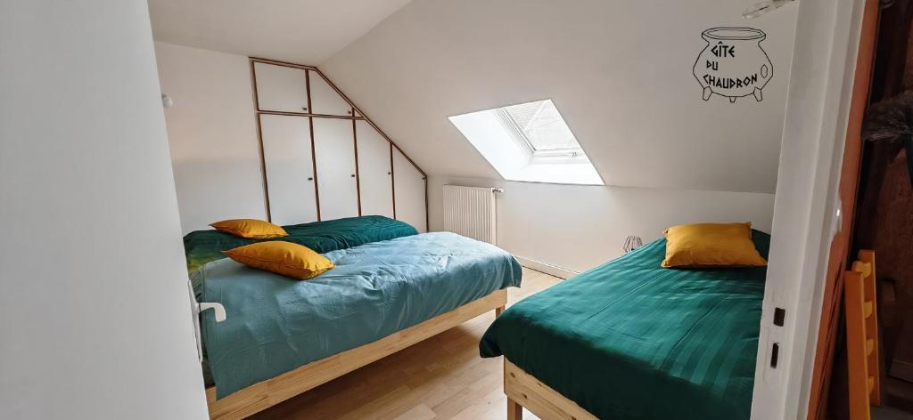 Postel nebo postele na pokoji v ubytování Gîte du Chaudron