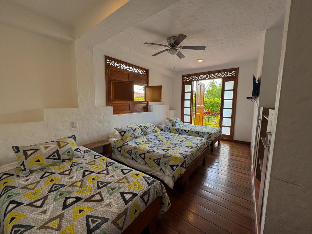 Postel nebo postele na pokoji v ubytování Casa Santa Rita - Tres Habitaciones