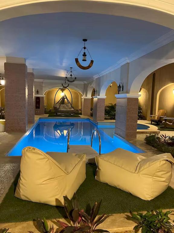 a living room with a blue lighting in a house at Resort in Cairo