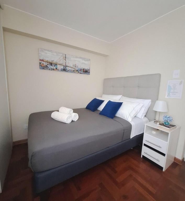 a bedroom with a bed with two towels on it at Room in shared apartment - Shared Bathroom 402 in Lima