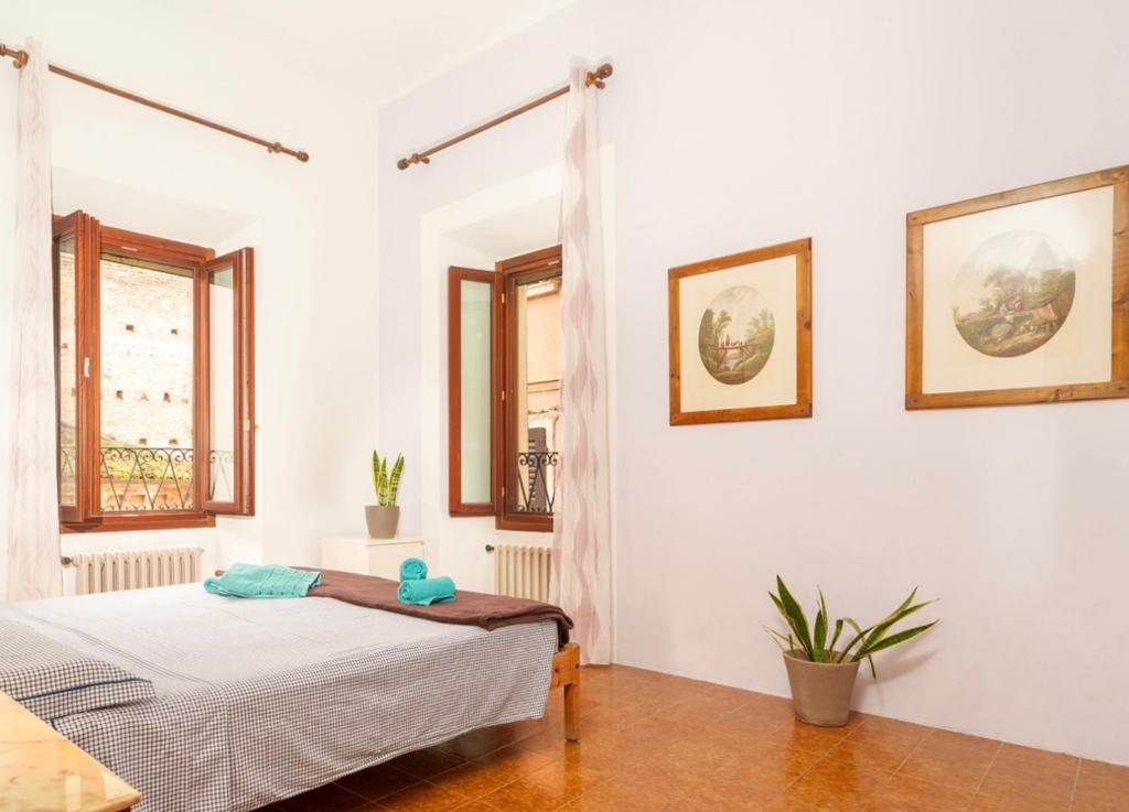 Ένα ή περισσότερα κρεβάτια σε δωμάτιο στο Casa di Elia