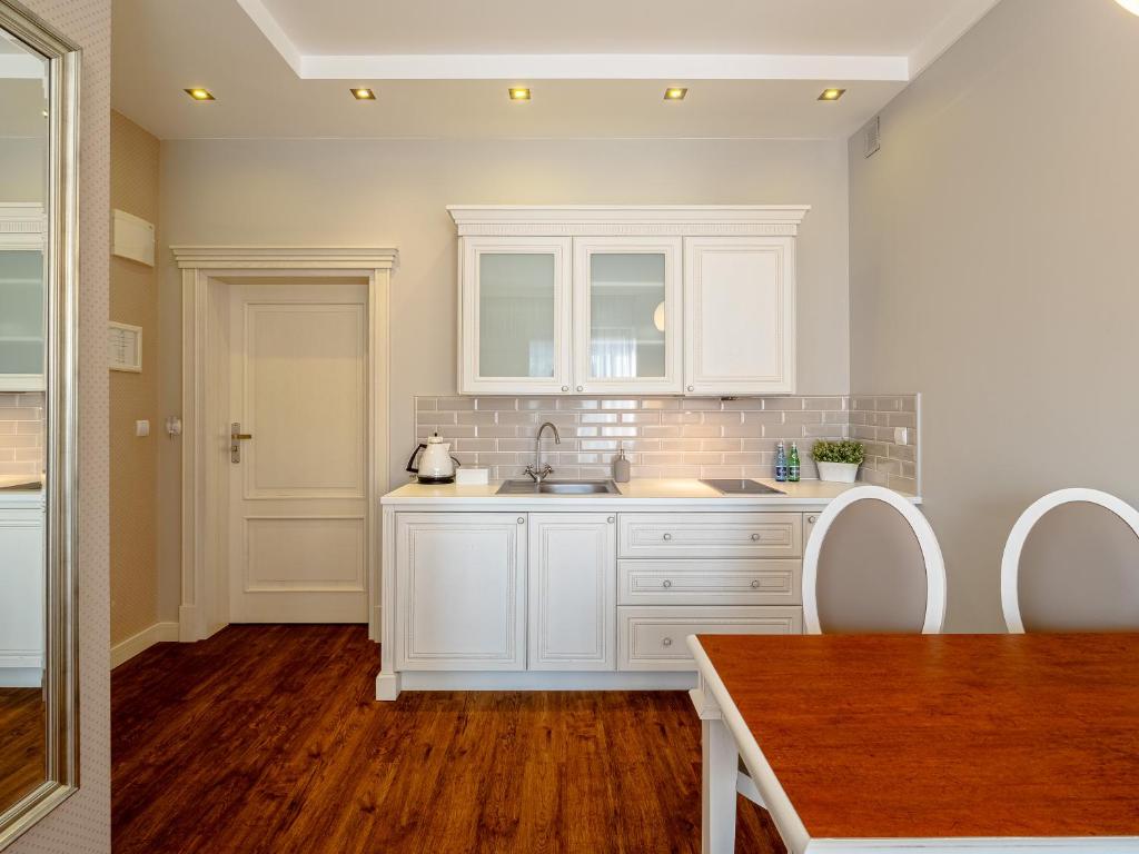 Kuchyň nebo kuchyňský kout v ubytování Perla Mare Apartamenty