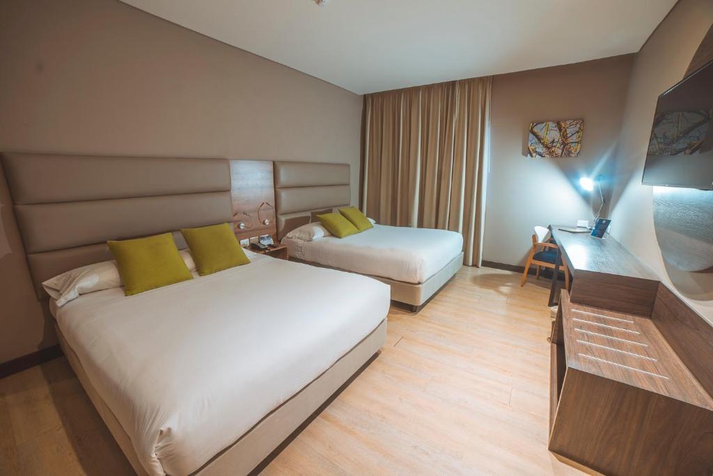 Postel nebo postele na pokoji v ubytování Hotel F25