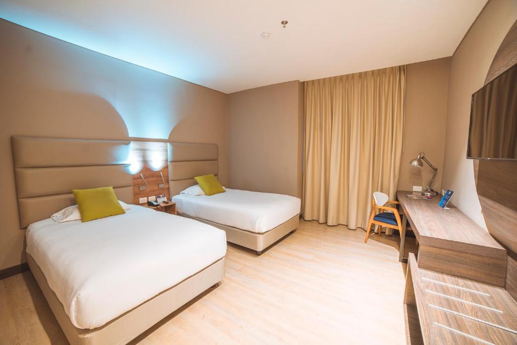 Postel nebo postele na pokoji v ubytování Hotel F25