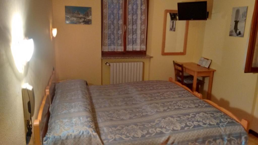 Postel nebo postele na pokoji v ubytování Albergo Ristorante Sole