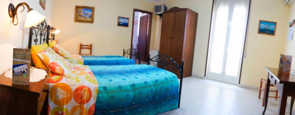 Postel nebo postele na pokoji v ubytování Albergo Vittoria