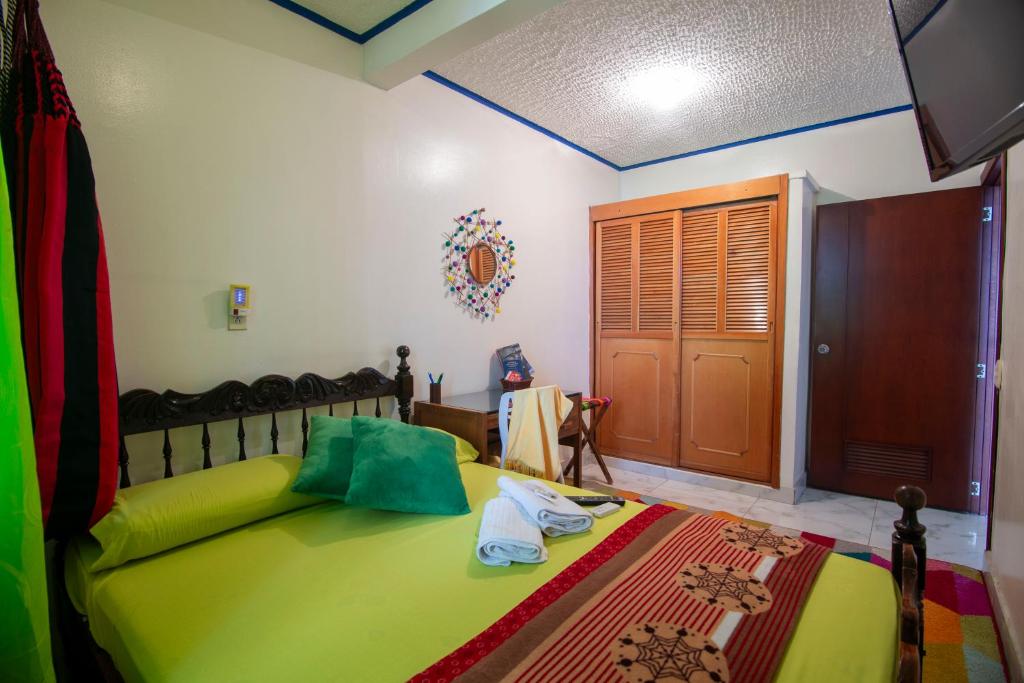 Postel nebo postele na pokoji v ubytování Antigua Hostal