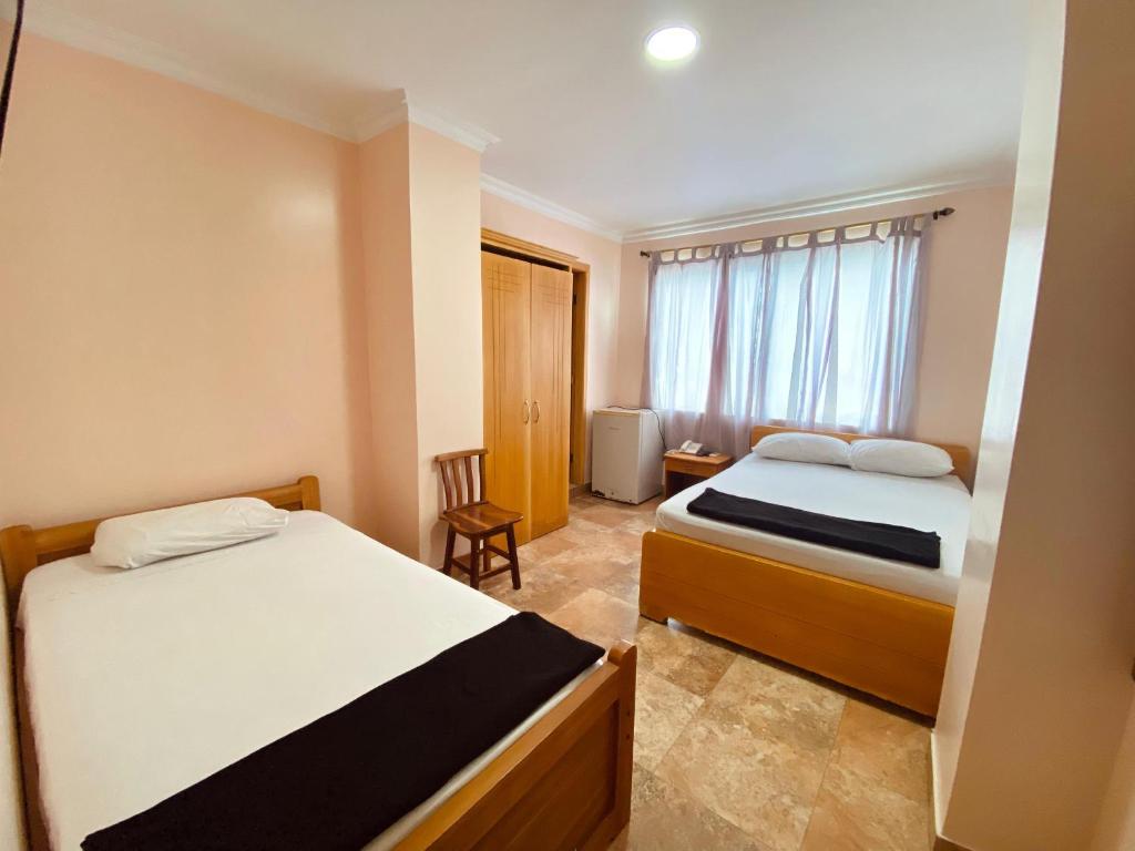Postel nebo postele na pokoji v ubytování HOTEL MARLUZ