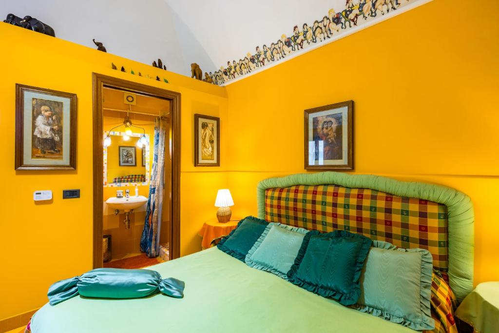 Postel nebo postele na pokoji v ubytování Orchid Corner Guesthouse