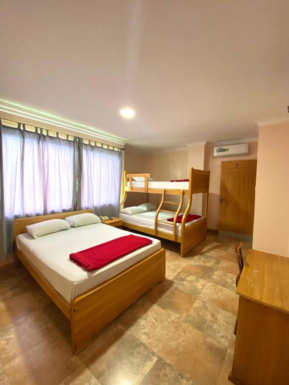 Postel nebo postele na pokoji v ubytování HOTEL MARLUZ