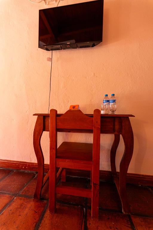 TV a/nebo společenská místnost v ubytování La Arcadia Hotel