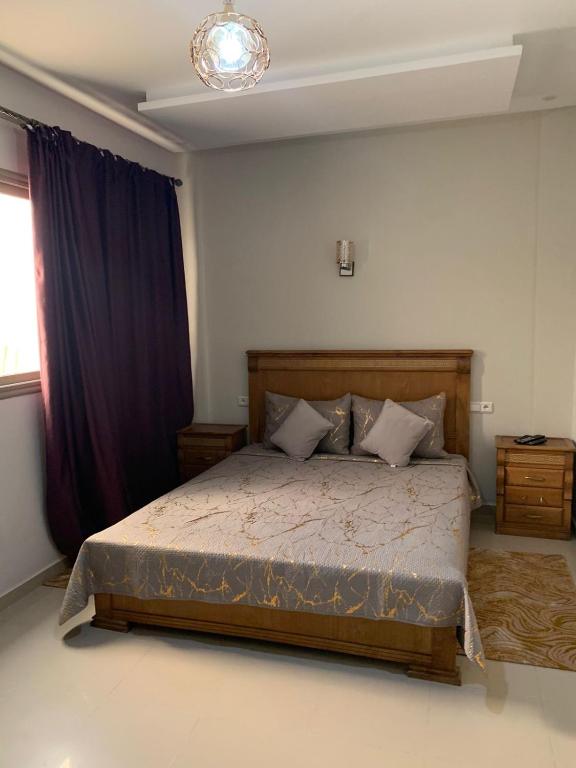 Ένα ή περισσότερα κρεβάτια σε δωμάτιο στο Appartement Agadir 2 chambres Nya