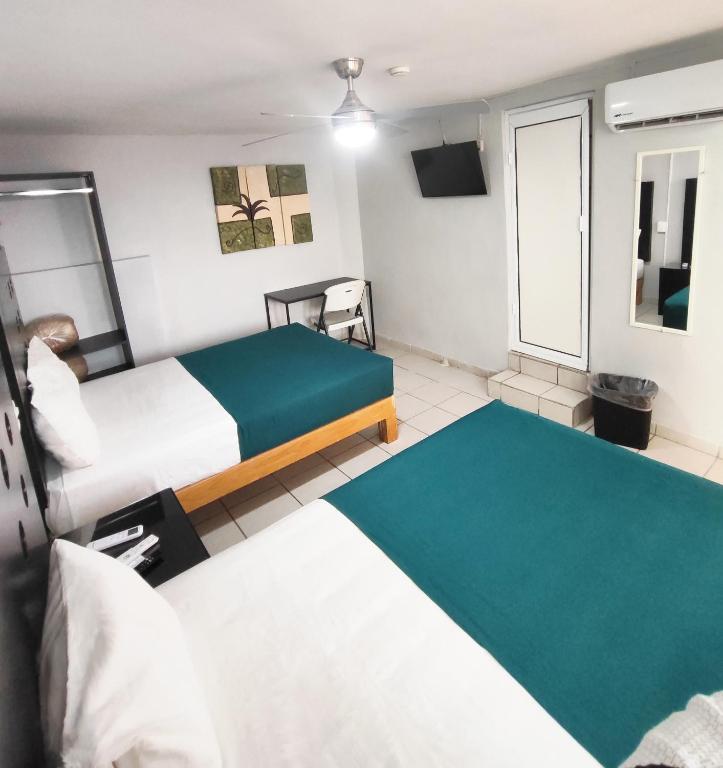 Postel nebo postele na pokoji v ubytování Hotel del Refugio
