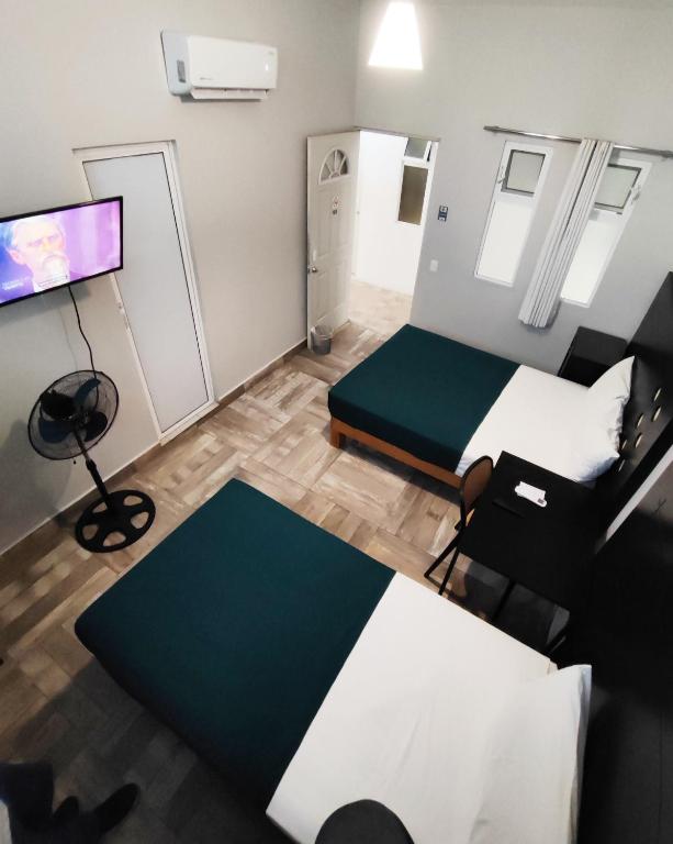 TV a/nebo společenská místnost v ubytování Hotel del Refugio