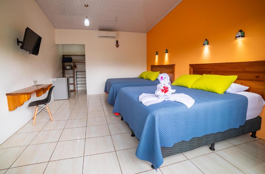 Postel nebo postele na pokoji v ubytování Hotel Secreto La Fortuna