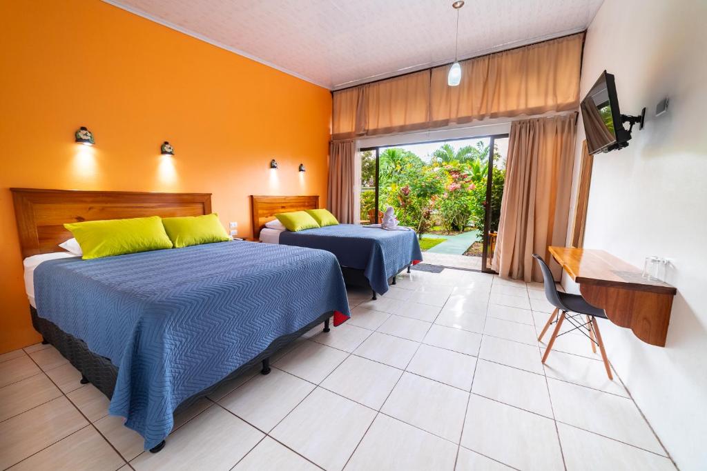 Postel nebo postele na pokoji v ubytování Hotel Secreto La Fortuna