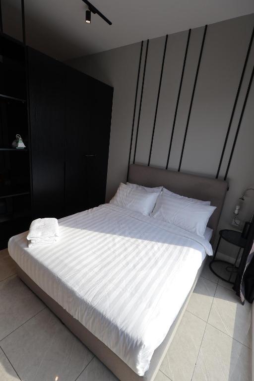 Postel nebo postele na pokoji v ubytování Axon Residence Damai Bukit Bintang