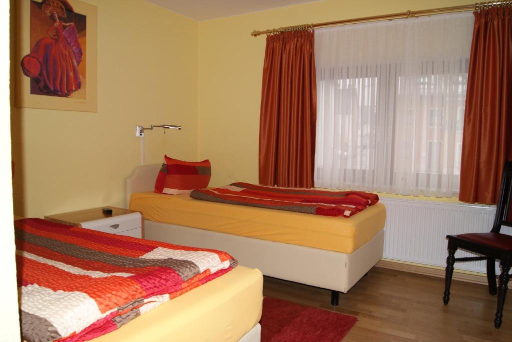 Postel nebo postele na pokoji v ubytování Hotel Kugel