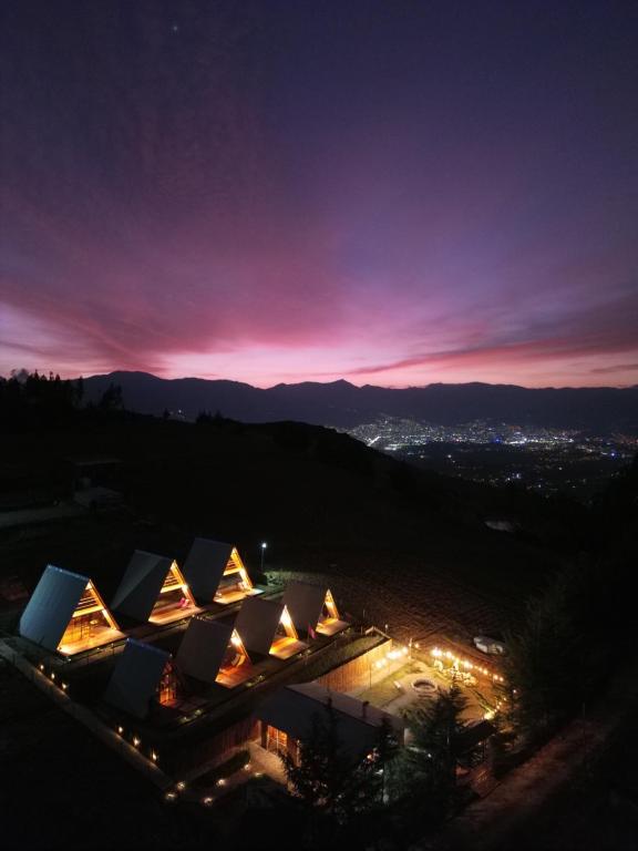 a view of the sydney opera house at night at GLAMPING NAKAMA Cajamarca in Cajamarca