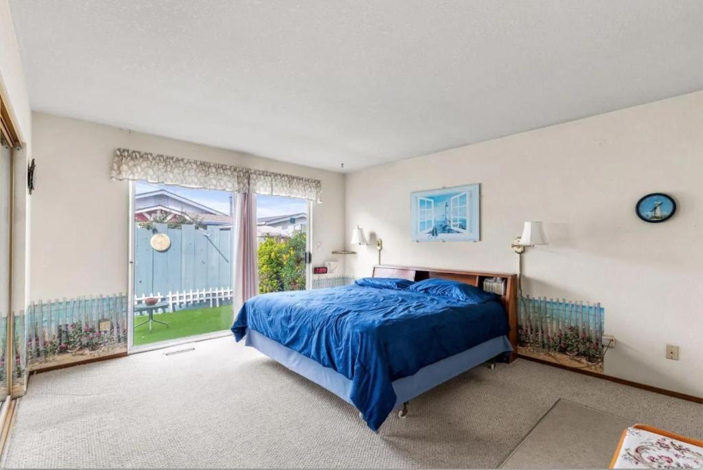 a bedroom with a bed and a large window at STR25-15 Master Bedroom Marina in Marina