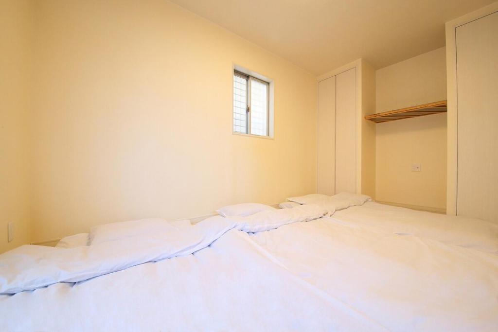 Postel nebo postele na pokoji v ubytování Nao house