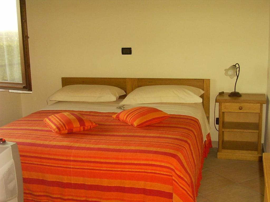 En eller flere senge i et værelse på Agriturismo Macìn