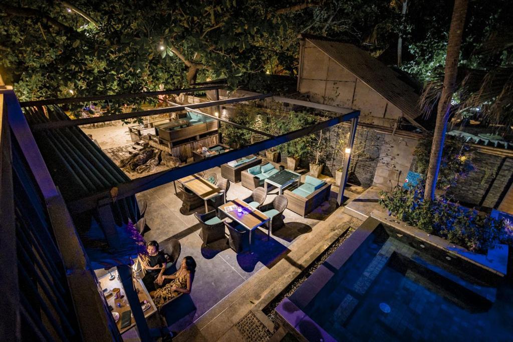 an overhead view of a swimming pool at night at 15 Palms Beach Resort in Ko Chang