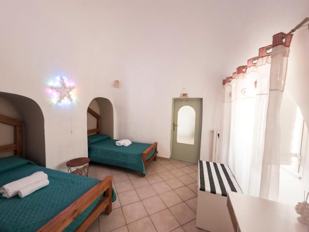 Postel nebo postele na pokoji v ubytování Trulli Mamima