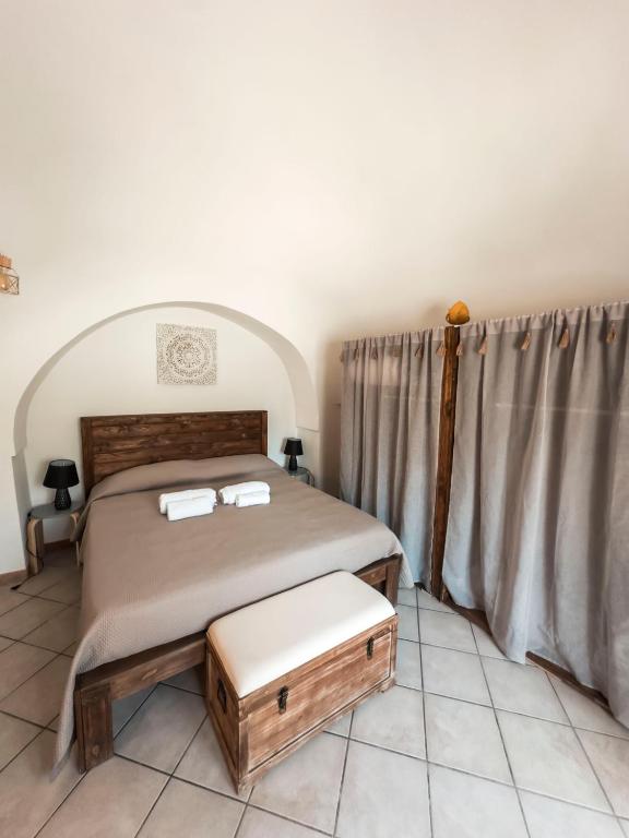 Postel nebo postele na pokoji v ubytování Trulli Mamima