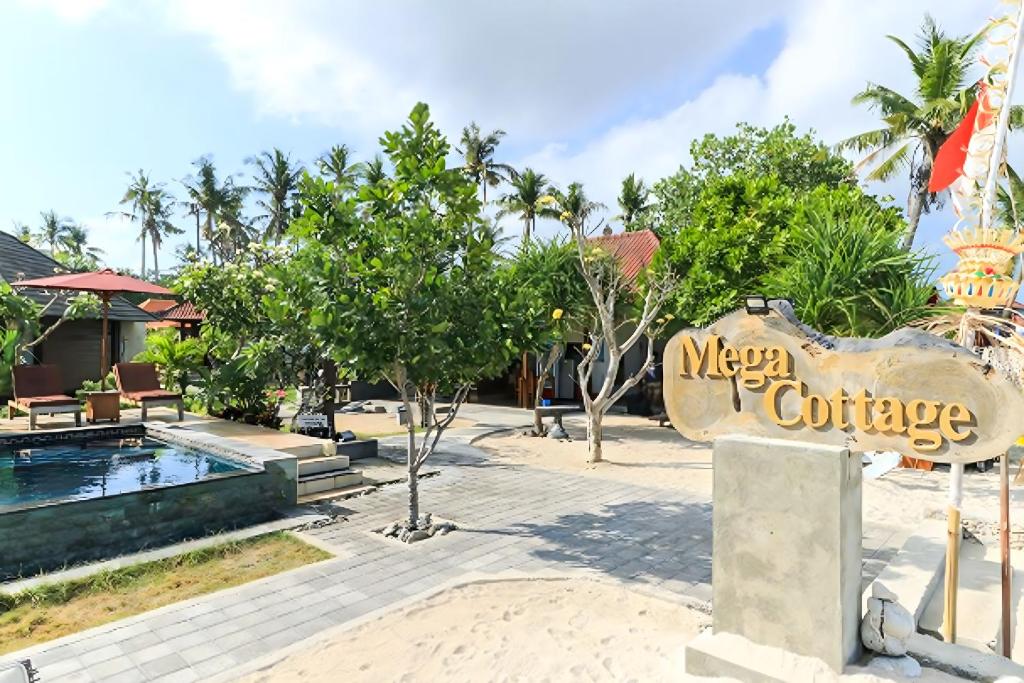 a sign for a mexican cottage in front of a resort at Mega Cottages in Nusa Lembongan