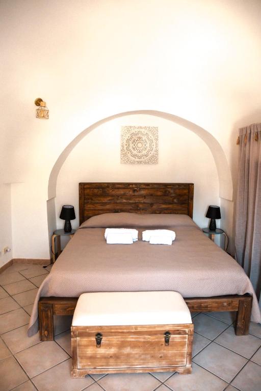 Postel nebo postele na pokoji v ubytování Trulli Mamima