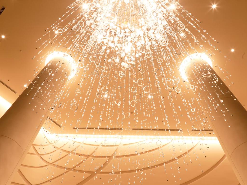 a chandelier hanging from the ceiling of a building at Hotel Universal Port Vita in Osaka
