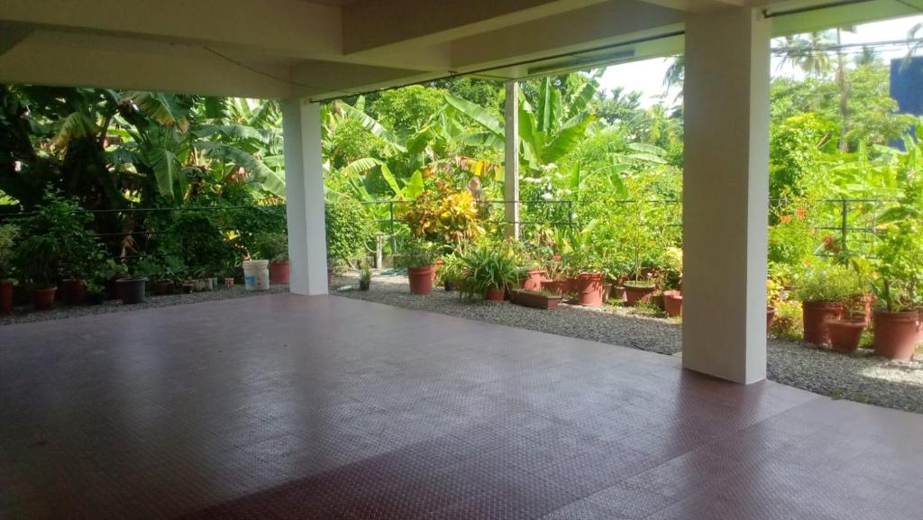 a room filled with lots of potted plants at Indeevaram Residency in Trivandrum