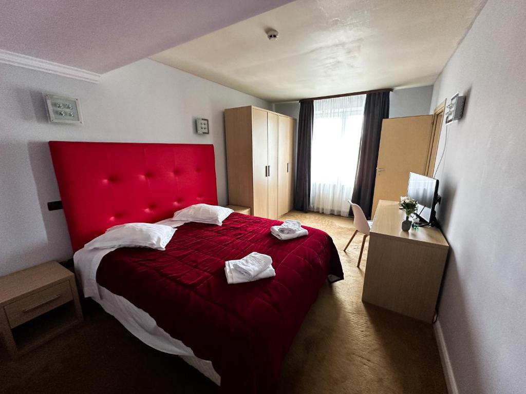Postel nebo postele na pokoji v ubytování Grand Master Hotel