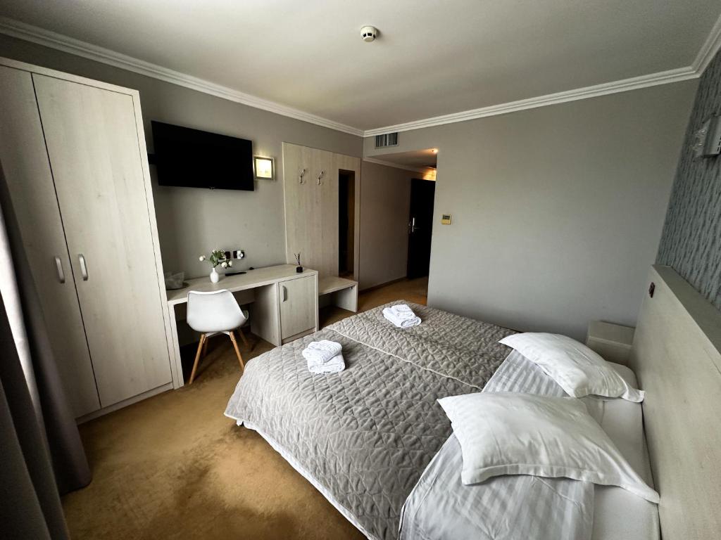 Postel nebo postele na pokoji v ubytování Grand Master Hotel