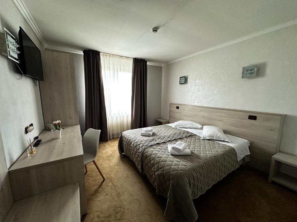 Postel nebo postele na pokoji v ubytování Grand Master Hotel