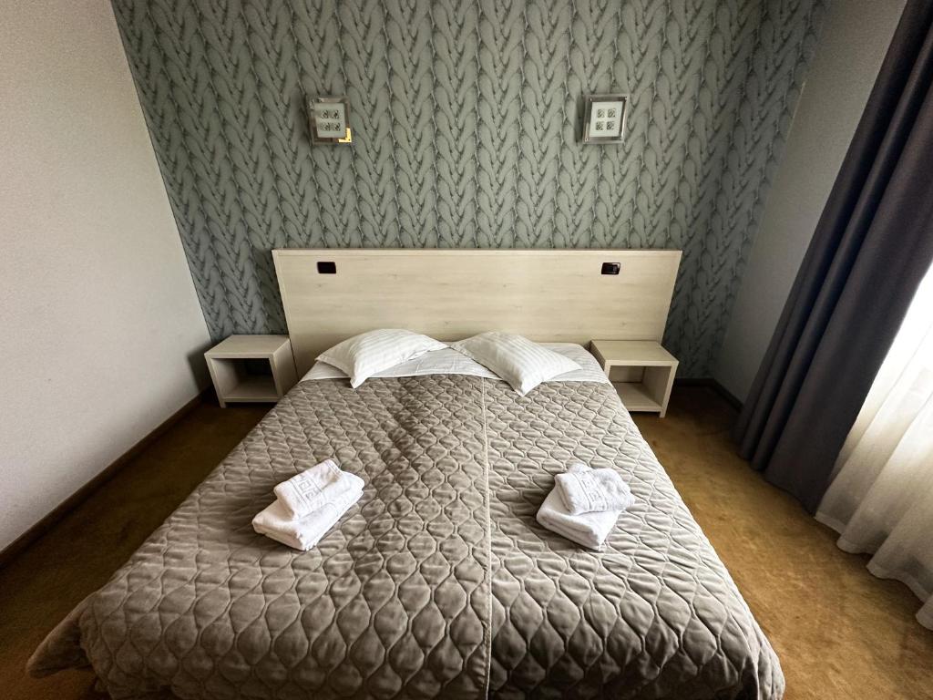 Postel nebo postele na pokoji v ubytování Grand Master Hotel