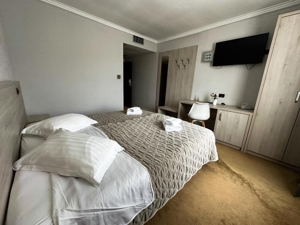 Postel nebo postele na pokoji v ubytování Grand Master Hotel