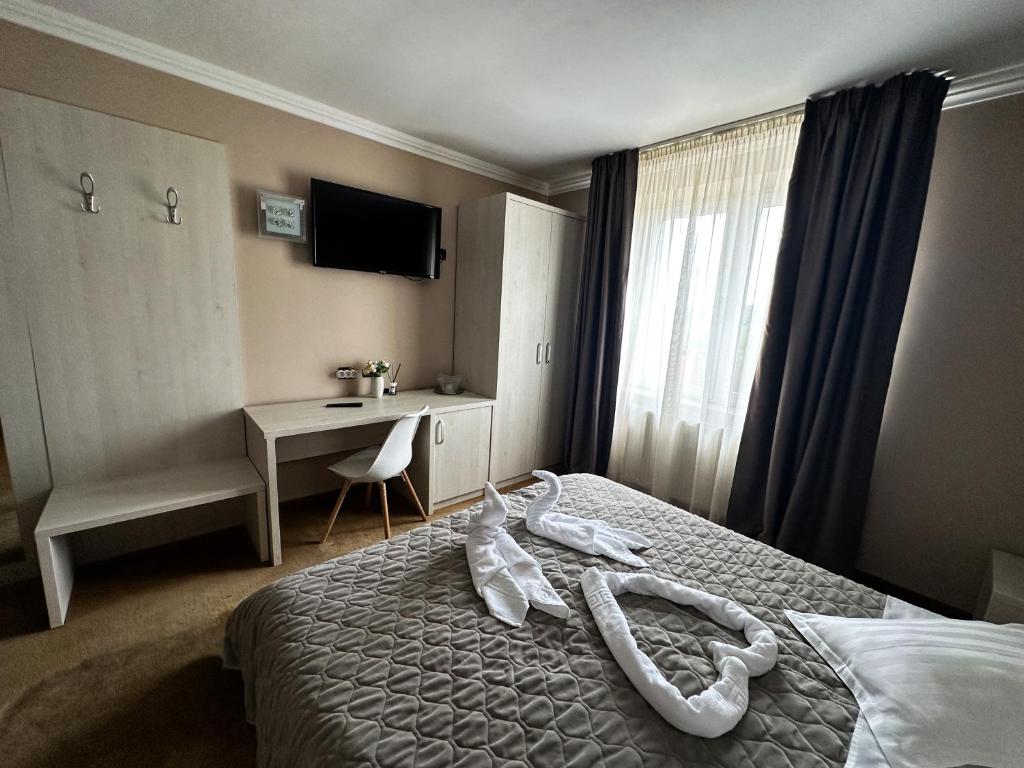 Postel nebo postele na pokoji v ubytování Grand Master Hotel