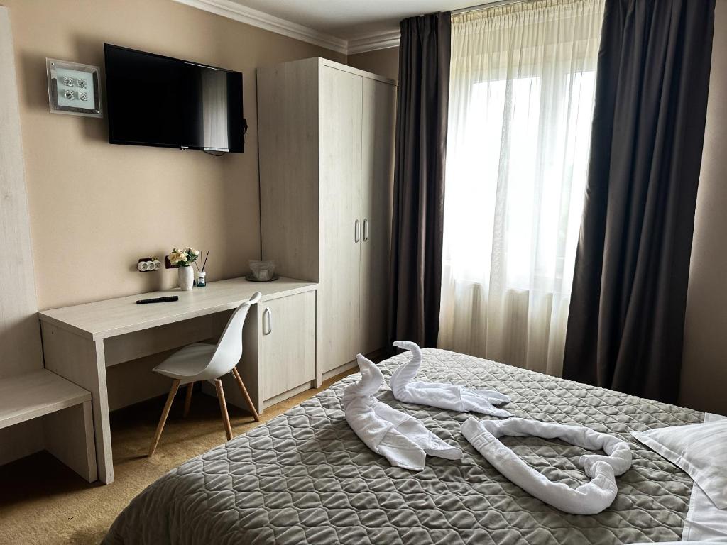 Postel nebo postele na pokoji v ubytování Grand Master Hotel