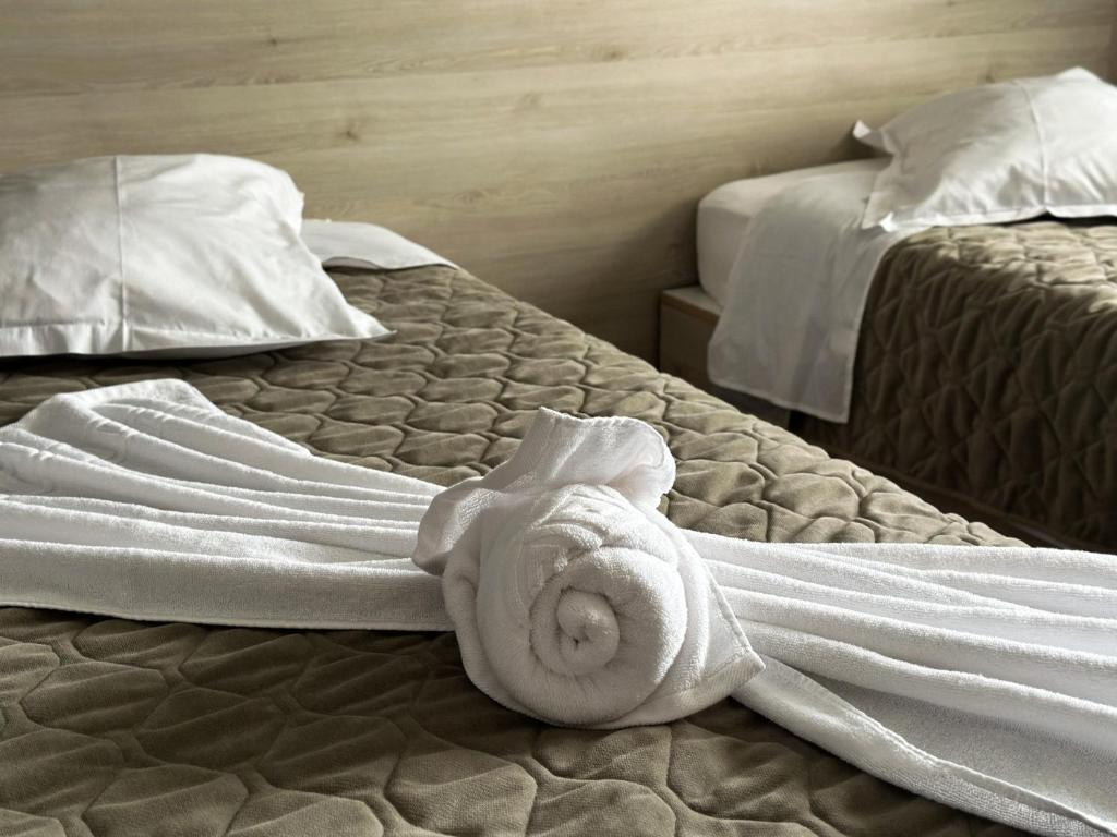 Postel nebo postele na pokoji v ubytování Grand Master Hotel