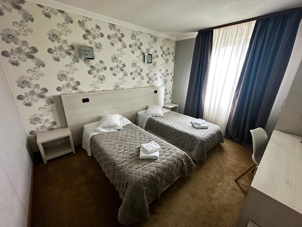 Postel nebo postele na pokoji v ubytování Grand Master Hotel