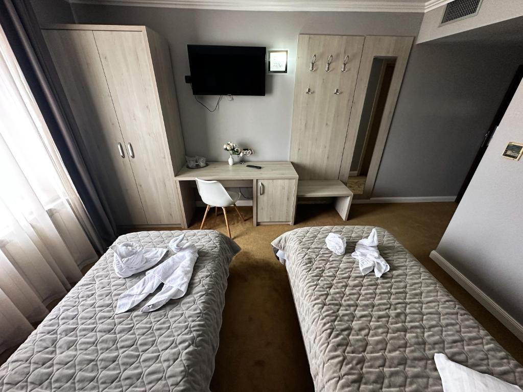 Postel nebo postele na pokoji v ubytování Grand Master Hotel
