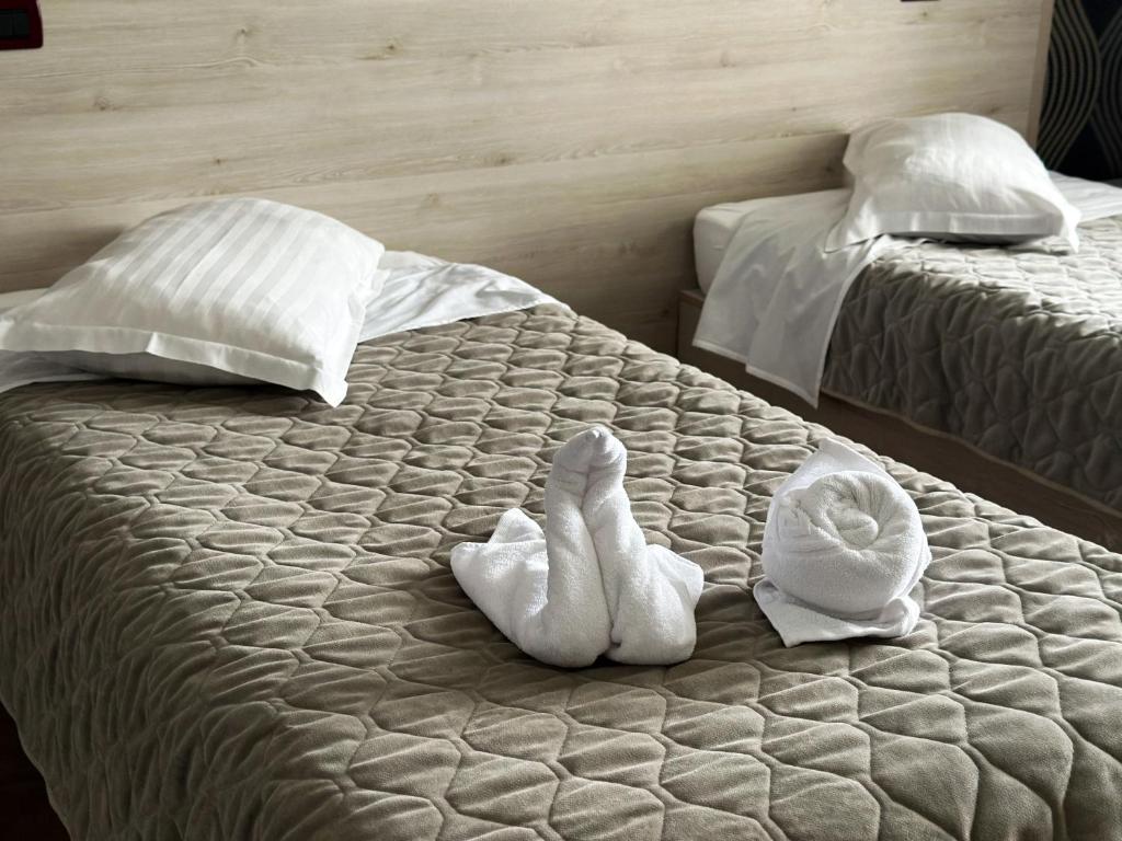 Postel nebo postele na pokoji v ubytování Grand Master Hotel