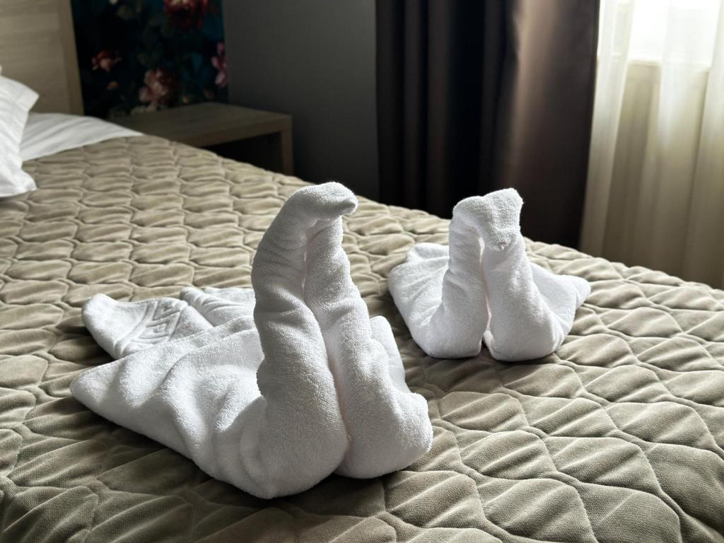 Postel nebo postele na pokoji v ubytování Grand Master Hotel