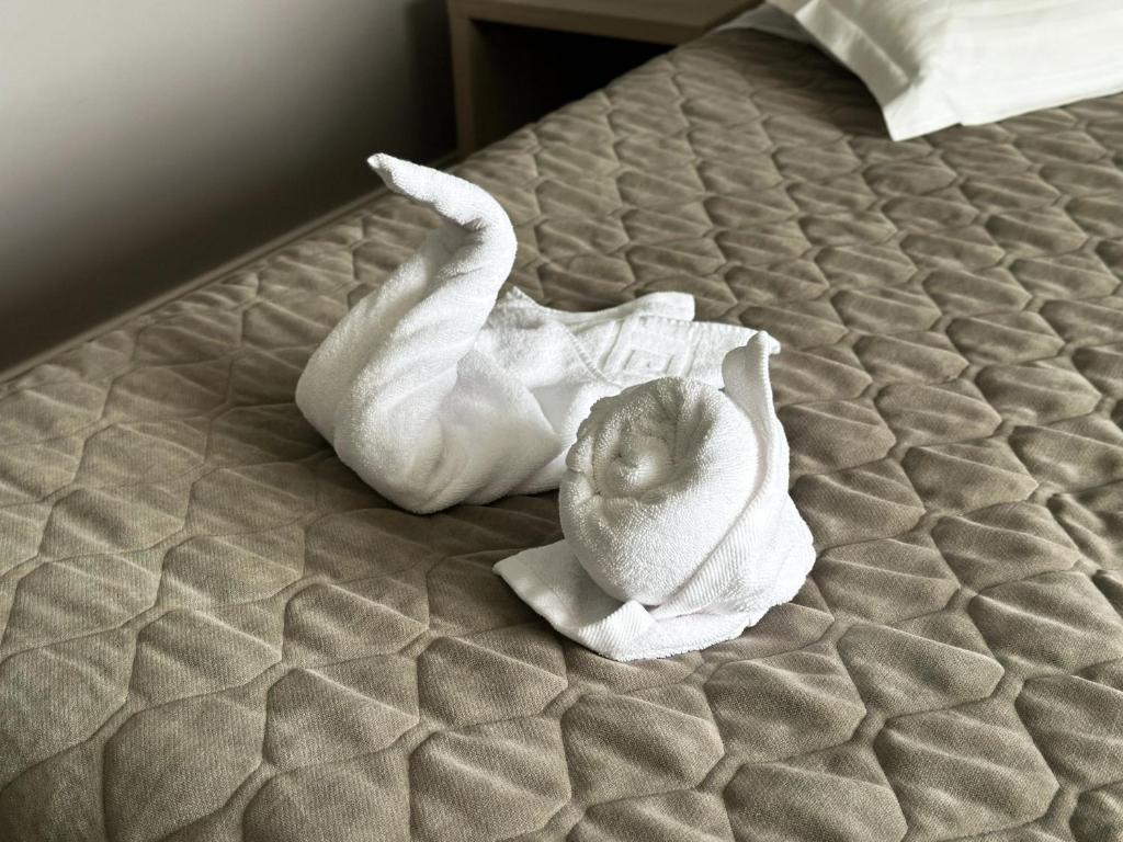 Postel nebo postele na pokoji v ubytování Grand Master Hotel