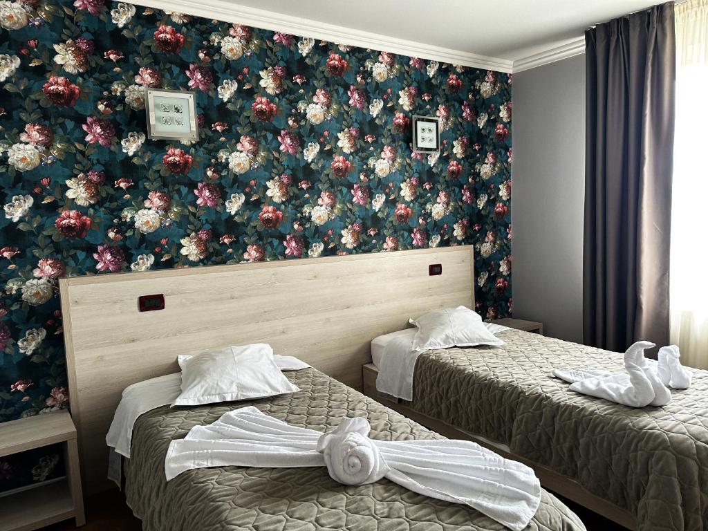 Postel nebo postele na pokoji v ubytování Grand Master Hotel