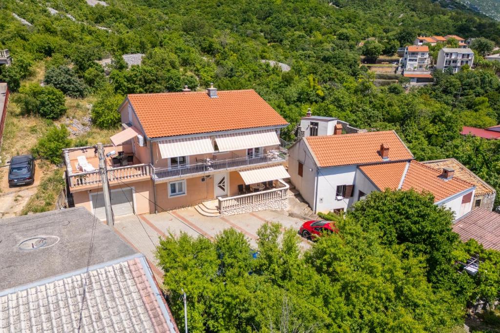 an aerial view of a house with an orange roof at Apartments and rooms Bionda in Senj